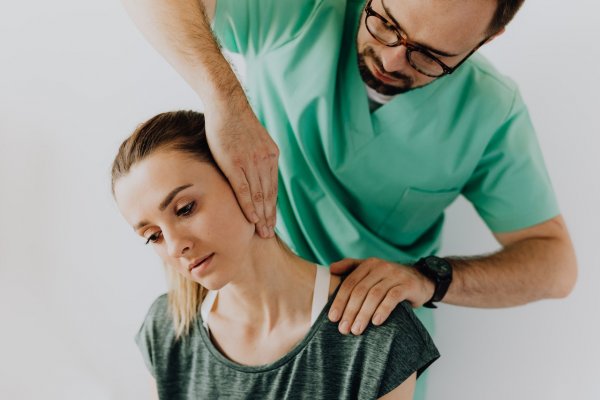 nurse working on patients neck